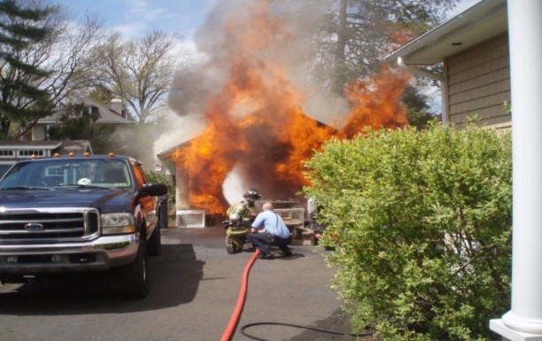 Fire Company suppressing a house fire. Fire Company suppressing a house fire.